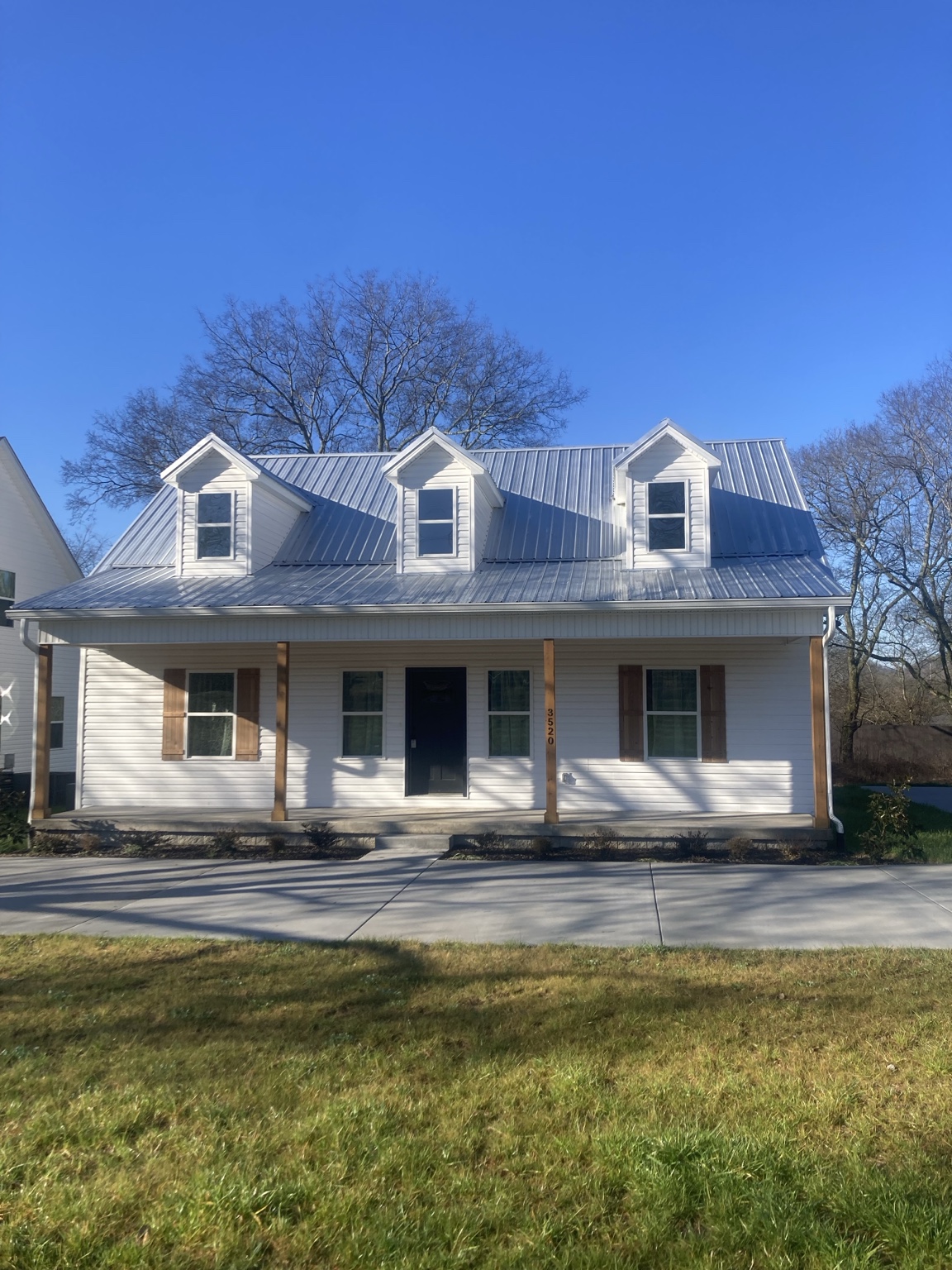 Traditional custom home exterior managed by James Chamberlin