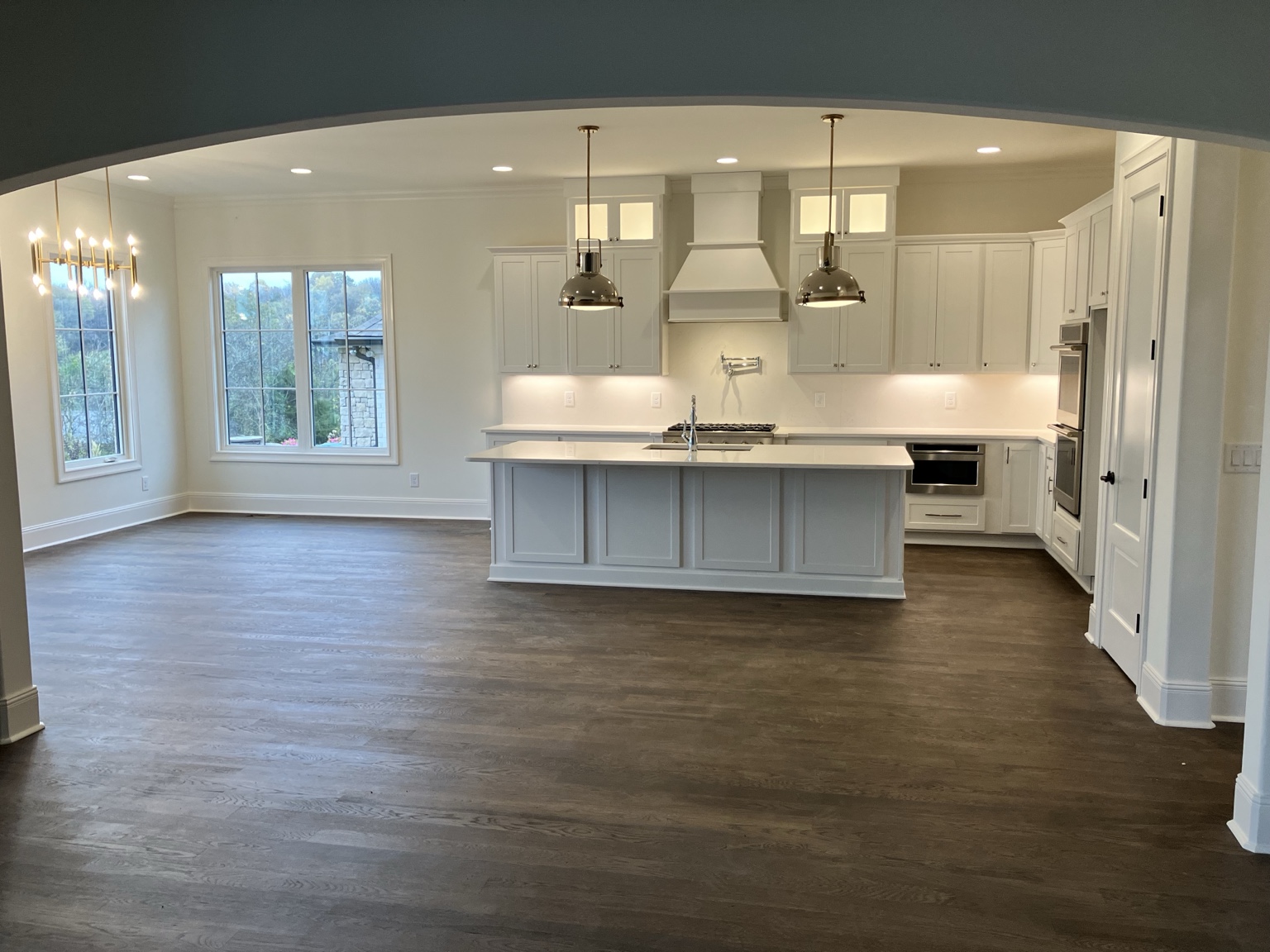Finished custom white kitchen with large island