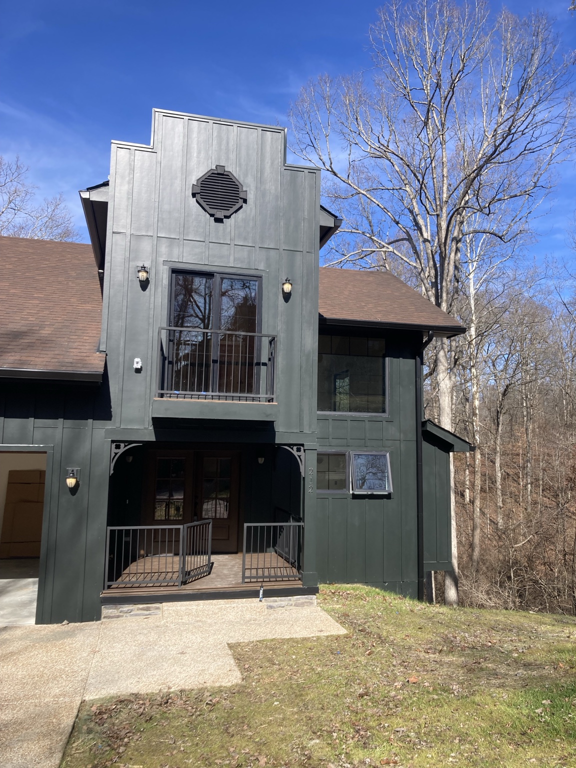 Dark modern custom home exterior managed by James Chamberlin